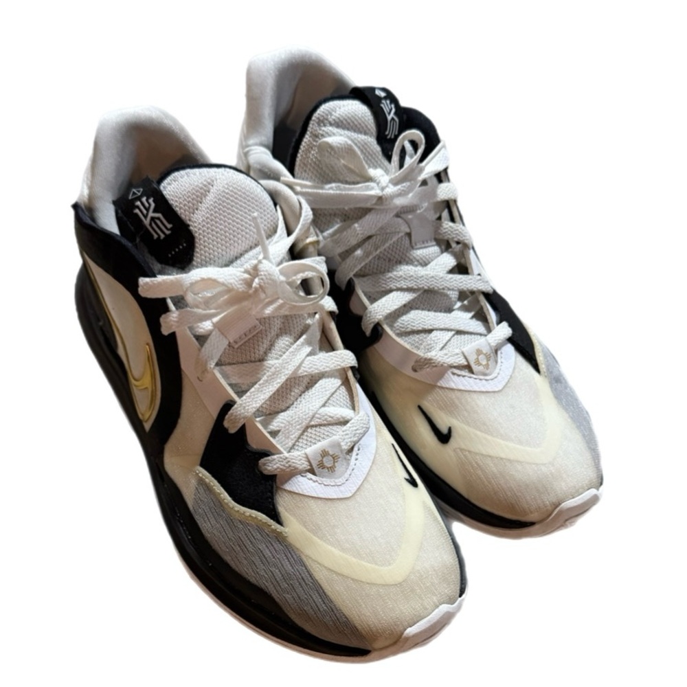 Nike Kyrie Low 5 men’s 10 sneakers in a cream, black, and metallic gold color.